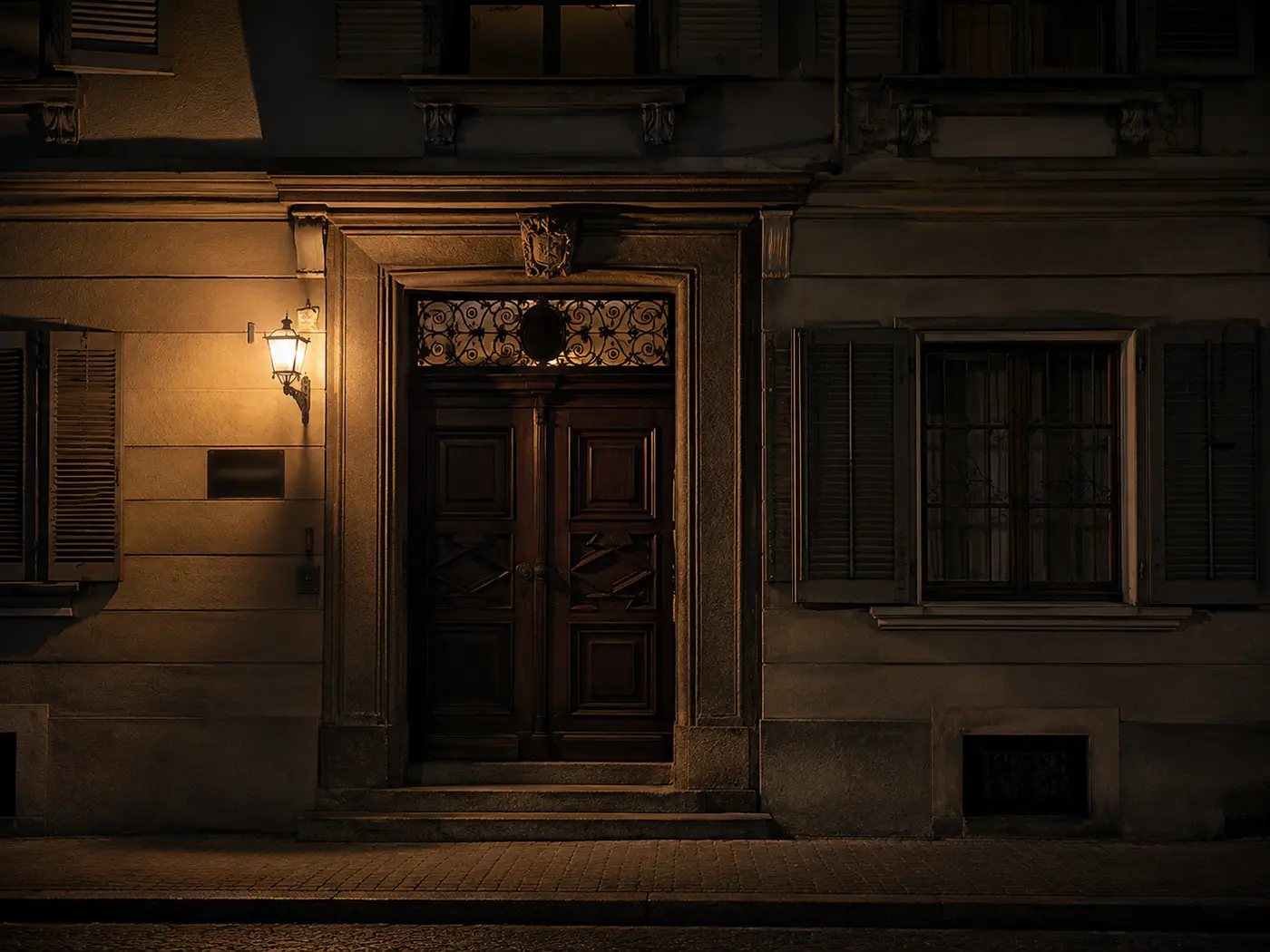 A discreet stone facade in Zurich at night